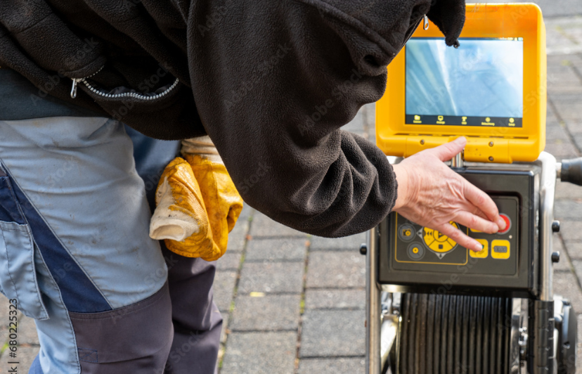 Close-up of sewer camera screen showing interior pipe conditions